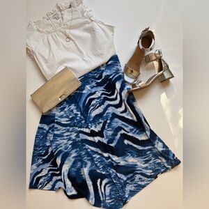 Chico’s size 2 handkerchief style, lightweight skirt with water pattern.